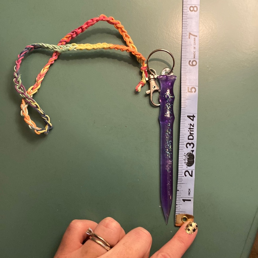 Purple resin self defense keychain with glow in the dark and teal glass pieces